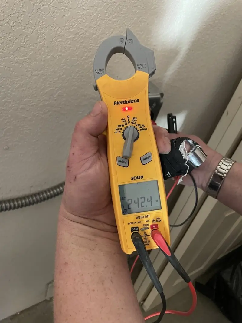 Voltage testing with clamp meter during Recessed Lighting Installation in Mill Creek